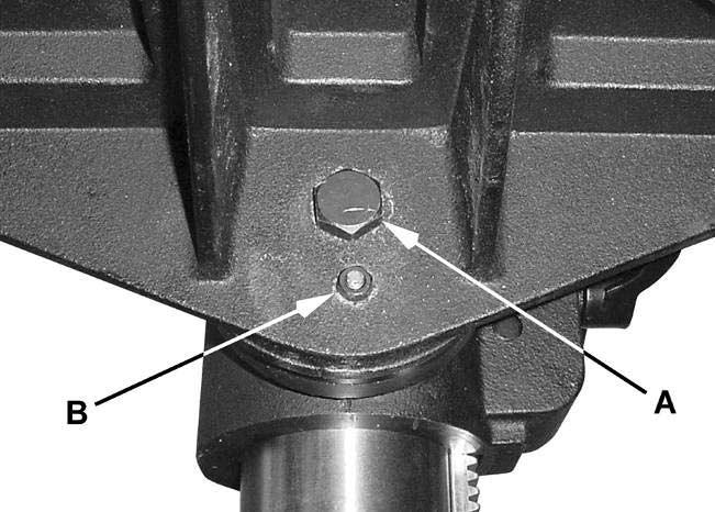 4. Pull out the cover and rotate until the pin (C) on the return spring plate engages the next notch in the coil spring cover.