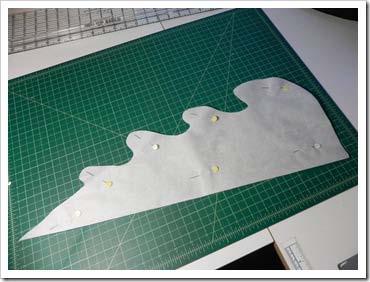 Cut a piece of fusible 16 by 22, fold it half lengthwise and cut out a fun