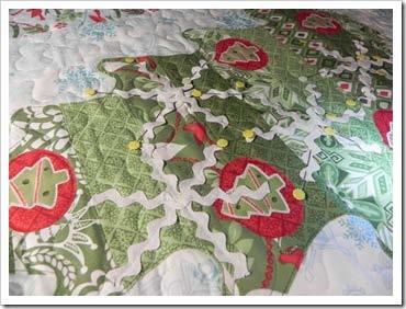 I removed them and made the quilt sandwich and quilted the wall hanging in a simple meander, changing