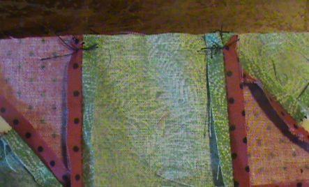 I tack where seams meet and I tack on the edge of joining two blocks. This keeps the fabric from moving so no stretching.