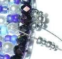 Without adding any new beads pass back through the last large metal seed bead.