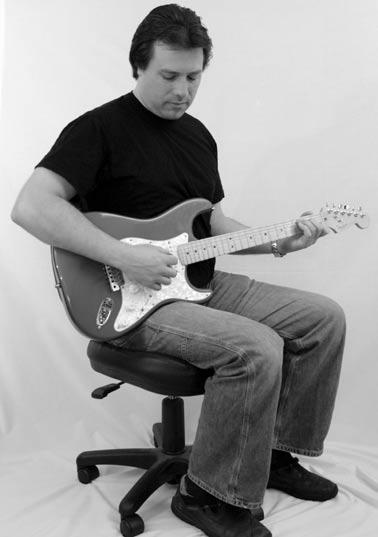 Sitting Position: Hold your guitar so that it rests on your right thigh (if you are left handed please switch to the opposite). Use the inside of your forearm to keep the guitar in place.
