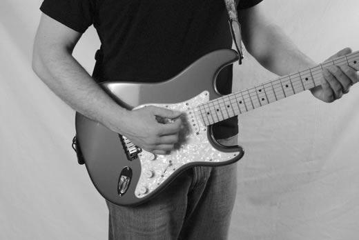 When fretting some chords and notes, it is acceptable to move your thumb above the neck.