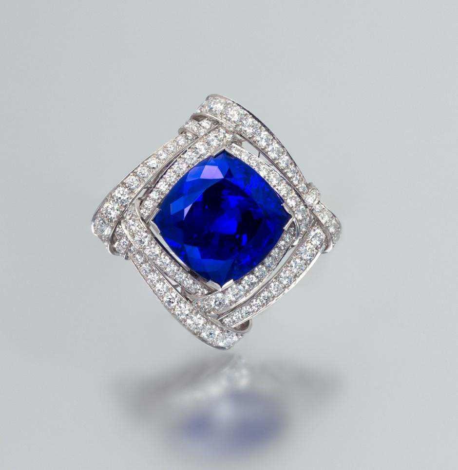 Lot 447 A Fine Platinum, Tanzanite, and Diamond Brooch, Van Cleef and Arpels, containing one cushion cut tanzanite that weighs approximately 66.