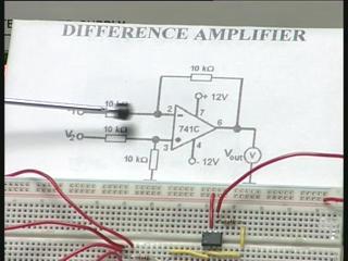 The gain A is 1 because all the resistors chosen in this circuit is 1 and in this circuit you can see the op amp here and the resistors, two resistors and the two other resistors are all shown here
