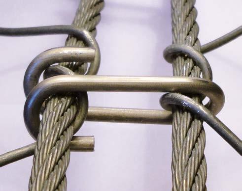enable the efficient transmission of loads to the top ropes and anchors, with minimal mesh deformation.