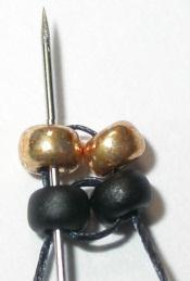 beads: 2 black, 4. Pass through beads again moving in the same direction.