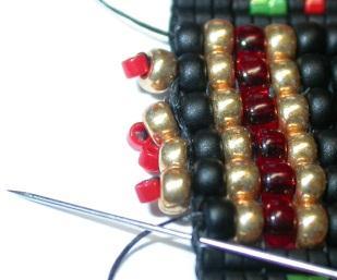 Pass up the fourth column of seed beads and exit the top black. Draw thread to form  40 41 40.