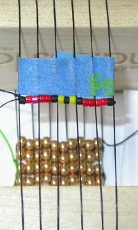 Flip the loom over so the starter is on the bottom and again using a ruler locate the