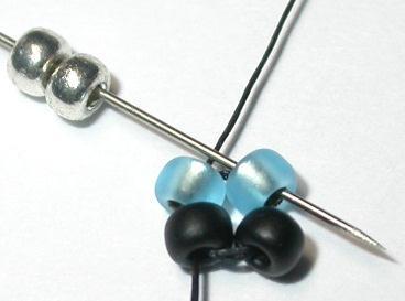Draw the thread to bring the beads side by side in two stacks of two beads