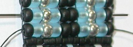 Pass up through the entire 2 nd column of seed beads to exit the black at the
