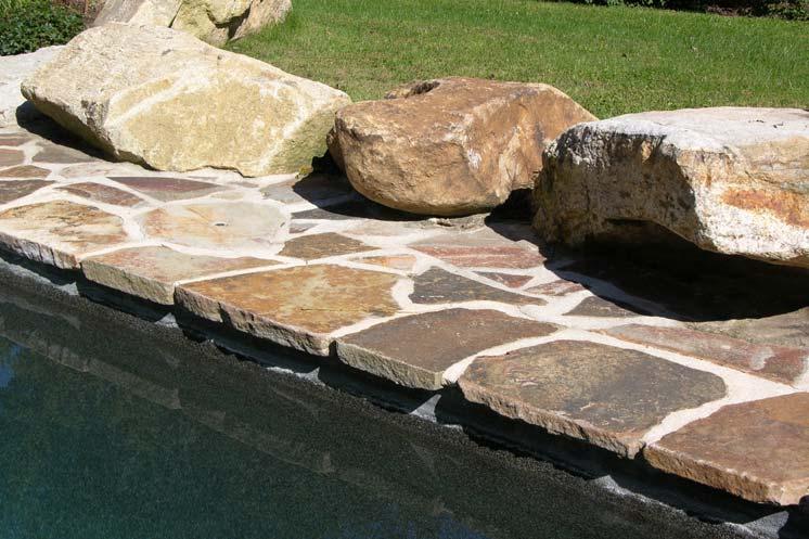 Large boulders can be artfully arranged to create different levels on a grade, to retain a large embankment or sea-wall, or as a prominent accent.