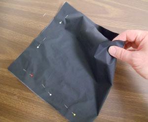 To prepare the inner lining fabric, use your original height and width measurements to cut a piece of the nylon fabric (we cut ours 21 inches wide by 10 inches high).