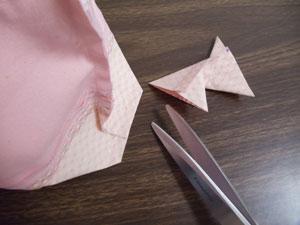 Take that measurement and mark out along each side of the center marks along the bottom seam.