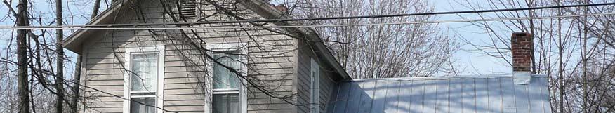 Gabled roof (originally slate or standing-seam metal).