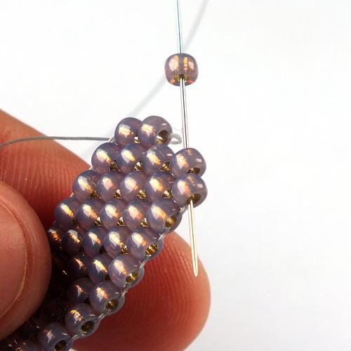 18) Add one 8/0 and pass through the next two beads on the