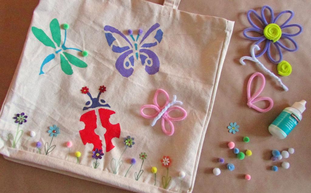 Junior Crafters Stenciled Bugs Tote Bag You Will Need Plain tote bag Paint Stencils Pipe cleaners Pom poms Tacky glue Flower embellishments How to Make 1.