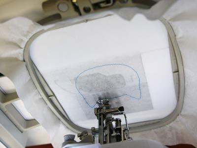 Attach the hoop to the machine and embroider the design.