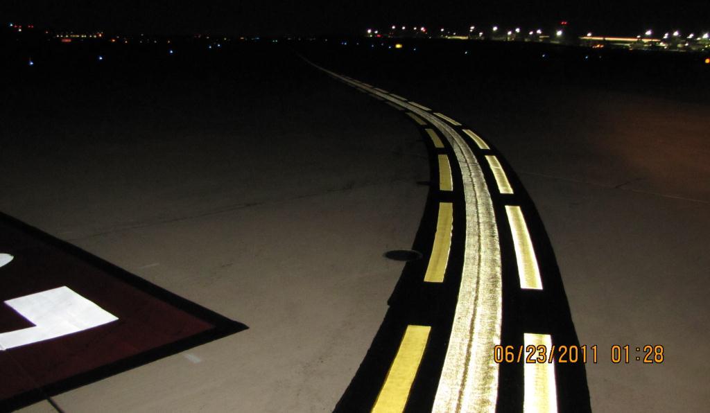 Figure 3. Enhanced Taxiway Centerline at Taxiway U and Runway 28. Type I beads are seen on the left side; Type III are seen on the right side (westerly direction). 4.