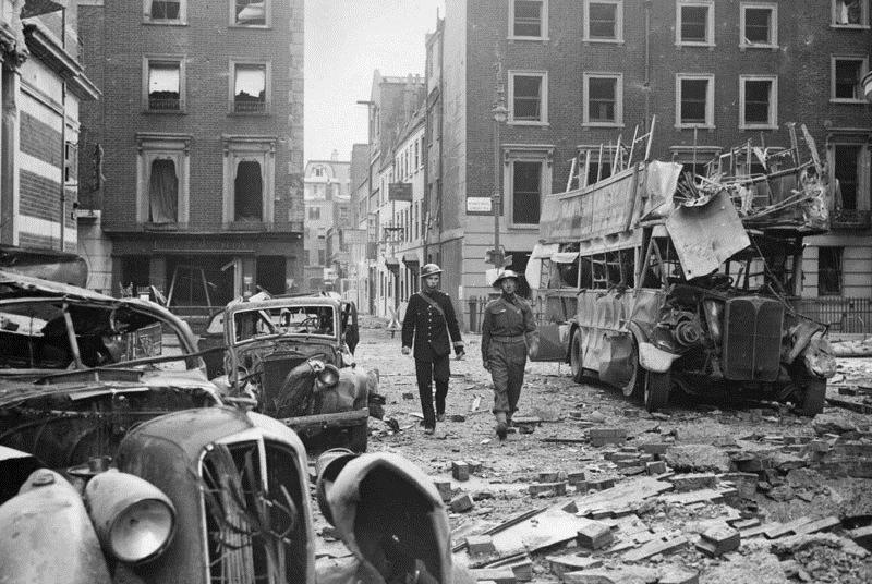 Picture 3 A police officer and a soldier inspecting the aftermath of a German air raid, Portman Street, London, 19 September