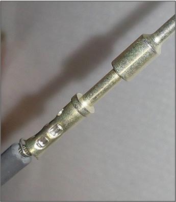 Visually check to assure the wire strands are visible in the inspection hole provided in the wire well. (Figure 3) b.