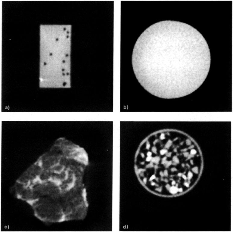 Figure 4. Tomographic images of a) OS' xl" aluminum block containing 1mm diameter holes (the lower left hole contains a piece of iron), b) 1.
