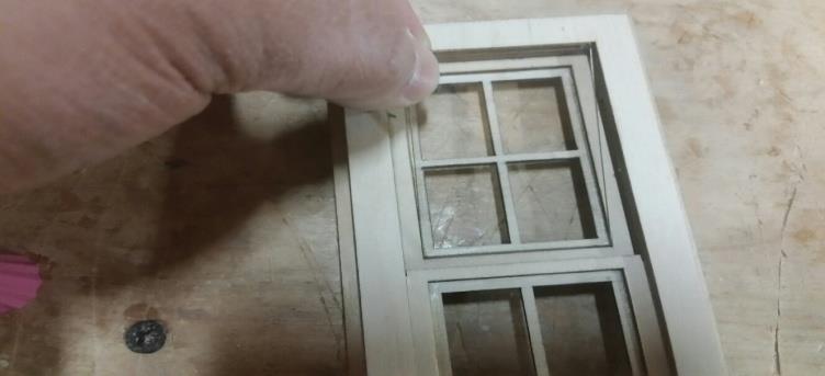 Apply a very thin coat of glue to inside edge of pane, figure B2.