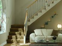 Gone is the traditional newel, now replaced by the same round handrail profile of the handrail.