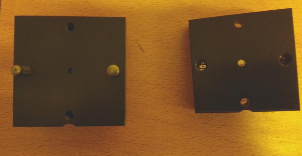 Figure 4: Inside view of the densitometer. On the left is the bottom half with the hole of the LED in the middle. On the right is the top half, with the PIN diode visible in the center.