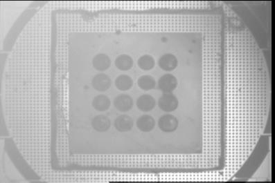 Chapter 7: Electrothermal Rotational Actuator 78 Fig. 7.5. Image of microlens array mounted on MEMS stage. Alignment is achieved with corner micro-bumps. (a) Fig. 7.6.