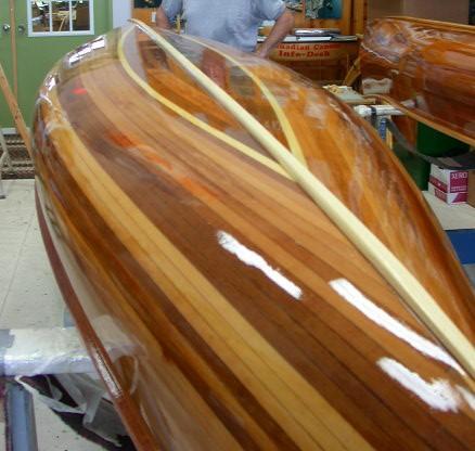 Here is an image of a canoe with the finished keel in place. It is entirely possible to stain the keel if you choose. Run masking tape along side to reduce smearing stain on you hull.