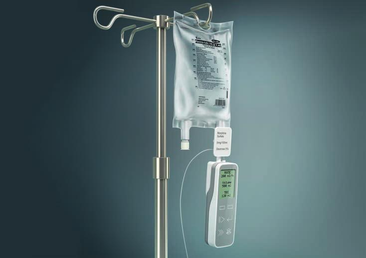 Miniature bedside infusion pump hanging from medication reservoir, directly reading RFID or barcode tags.