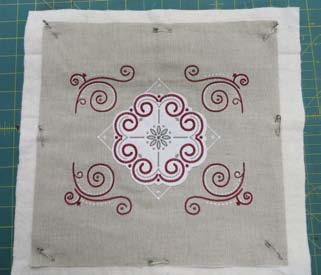 Supplies: OESD embroidery collection Seasonal Stitchery #12515 ½ yd. off-white linen fabric ¼ yd. red fabric (binding) 6" x 6" piece white fabric (appliqué) ½ yd.