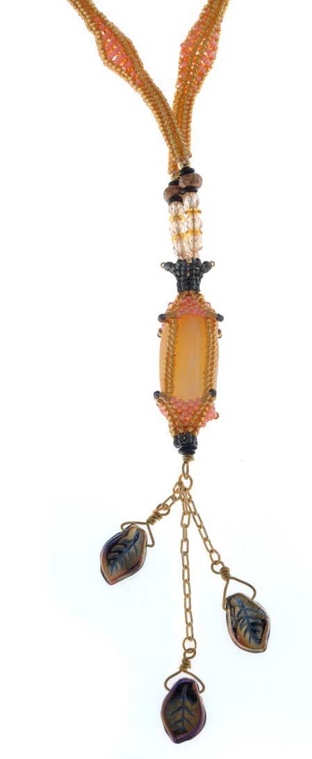 the bead. Here are a few examples. Fig. 6 Calcite Lantern (Fig. 6). In this design, the beadwork holds the structure together and traps the focal bead.