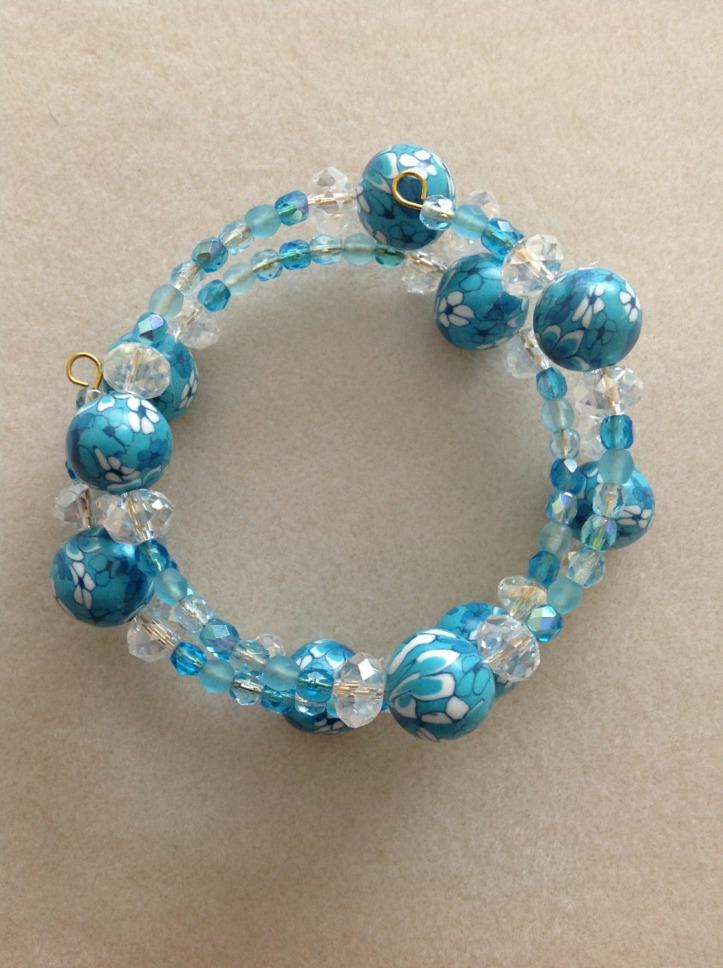 Memory wire bracelet in various blues with glass crystals, and