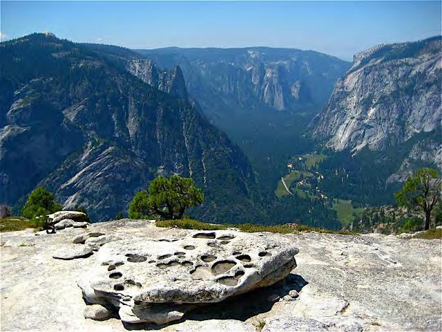 A digital photograph I took from the top of North Dome points along Yosemite Valley directly toward the riverbank where Watkins set up his camera (Looking West from North Dome, 2007, fig. X).