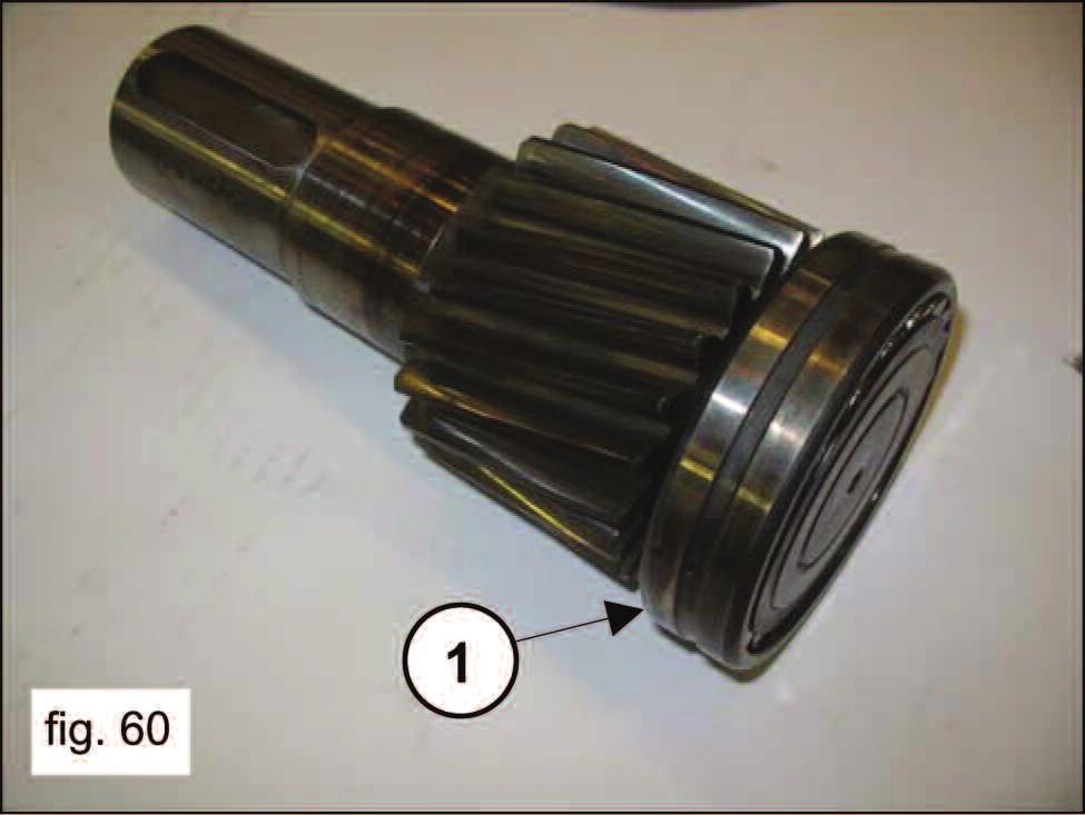 fig. 60) and fully insert the pinion in the