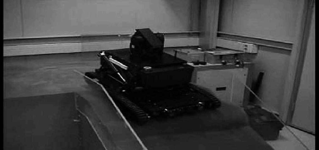 Double-track mobile robot for hazardous environment 457 (a) Figure 14. Uneven terrain navigation experiment: steps (a) 1 and (b) 2. 7.