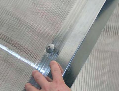 For some panels, tape can be applied at the seam between panels and under the polycarbonate by removing the screws and washers, installing the tape under the polycarbonate panels, and reinstalling