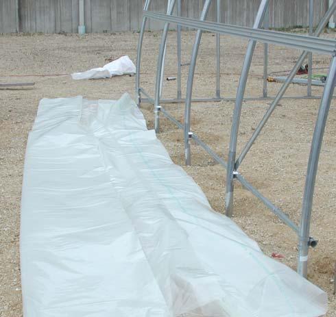 Photo shows the double U-channel attached to the greenhouse frame.
