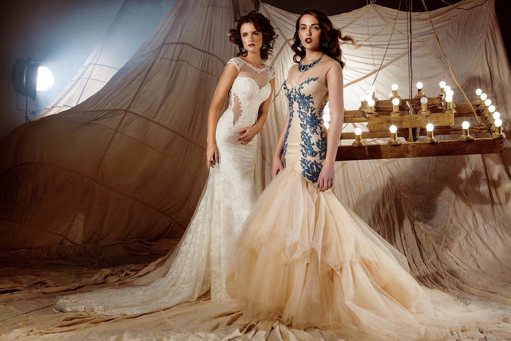 Indira Wholesale price: $315 Like a came out of the sea mermaid, which's tail has turned into a two-tiered skirt made of the three colors of tulle.