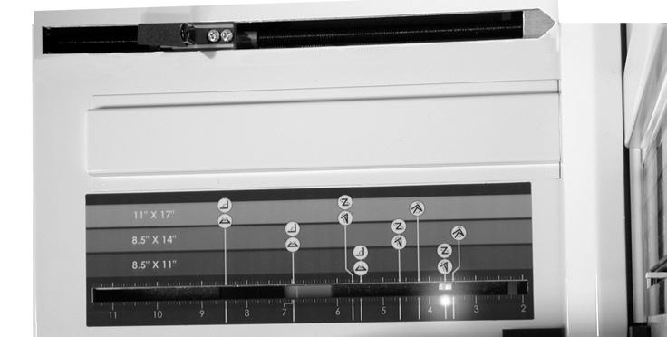 lights (46) that show through the inch scales on the fold table scales (17). This illustration shows the control knobs (18) and the location of all of the guide lights (46) on the scales.