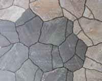 Define your space by using dark paver colors to line an area