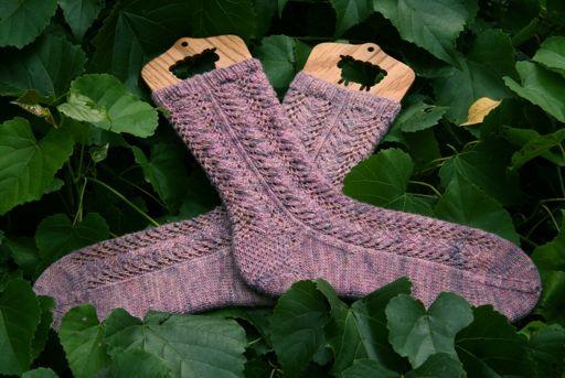 Spring Fern Socks a knitsnknishes design by Susan Lutsky PHOTO 1 One Size Fits Most. This pattern is knit cuff-down, using fingering weight yarn (approx. 350 to 400 yards, approx. 4 ounces).