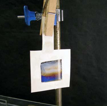 5. Use the clothespin/paper clip/binder clip to hang the soap bubble frame up steady. See Fig 13-1.1 below. The enlarged soap film on the right shows the correct behavior. 6.