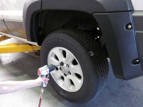 Use an impact wrench to re-install tire.