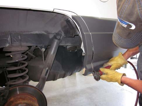Using a 10mm deep socket and wrench, remove bolts on inner side of fender lip (2 locations).
