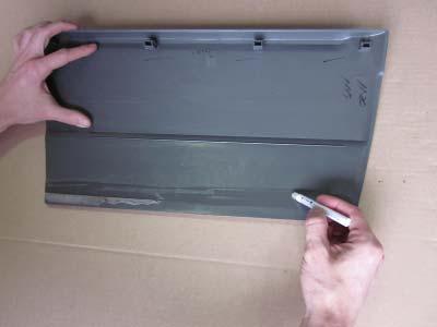 supplied primer applicator (AD1-0006) to plastic along bottom edge of