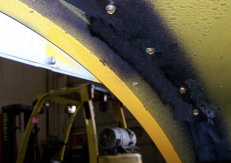 Remove any loose sealant or debris from the gapped area. Using a wire brush, wire wheel or die grinder, remove any paint from between the wheelhousing and gusset ledge.
