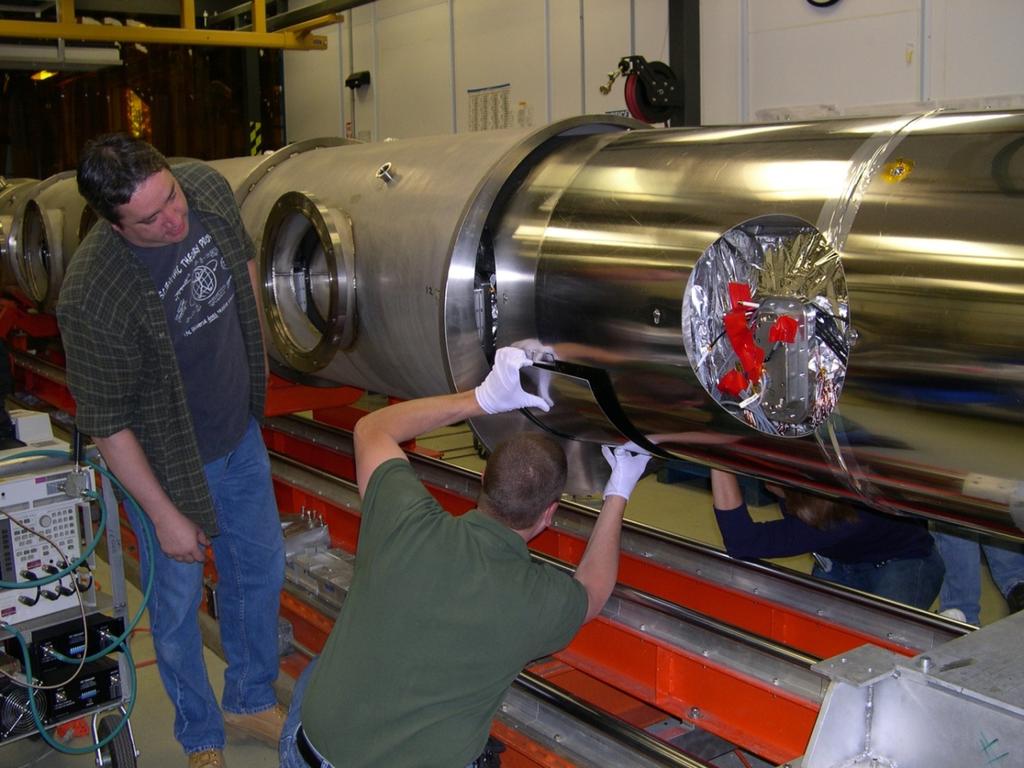 Superconducting Radio Frequency Cryomodule 12 GeV Upgrade Cryomodule Assembly showing insertion of Cold Mass